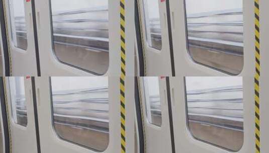 从地铁轻轨看向窗外，地铁轻轨高速行驶高清在线视频素材下载