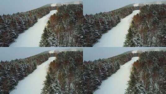 小雪期间，傍晚山上的滑雪者高清在线视频素材下载