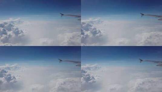 透过飞机舷窗拍摄窗外蓝天白云高清在线视频素材下载