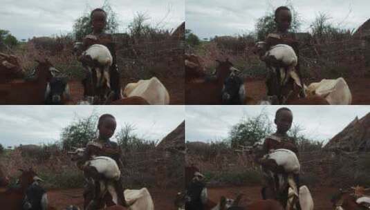非洲小孩抱着小羊高清在线视频素材下载