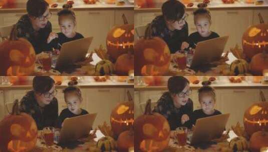 母亲和女儿看着笔记本电脑高清在线视频素材下载