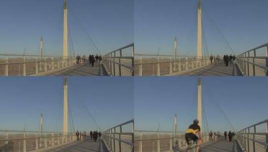 人行桥上骑自行车的男子高清在线视频素材下载