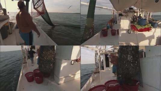 男人们从船上拉起渔网高清在线视频素材下载