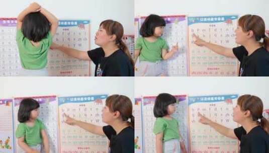 陪伴女儿学习汉语拼音的年轻母亲高清在线视频素材下载