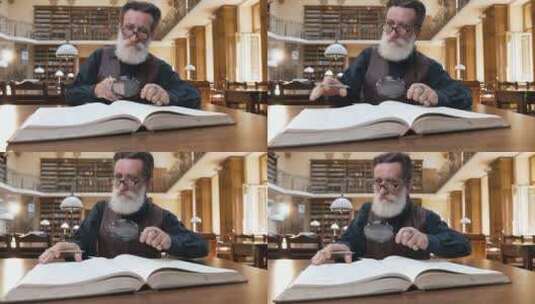 戴眼镜的老人用放大镜阅读书籍高清在线视频素材下载