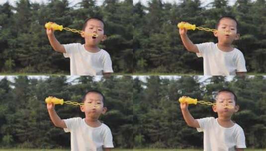 中国小朋友小孩玩玩具玩泡泡做鬼脸高清在线视频素材下载