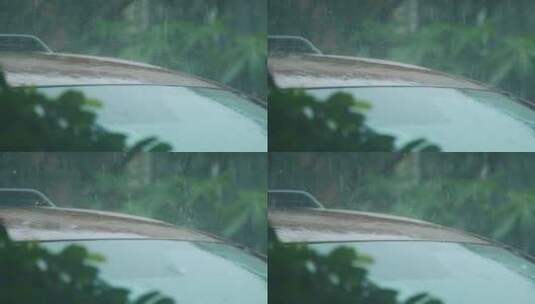 暴雨天气雨水滴落在车顶溅起水花慢镜头视频高清在线视频素材下载