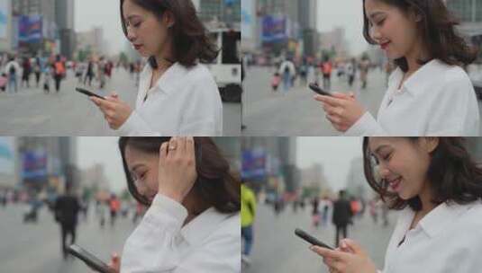 美女走在街头看手机侧面特写慢镜头高清在线视频素材下载