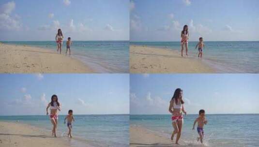 泳衣妈妈和孩子海边沙滩快乐奔跑高清在线视频素材下载
