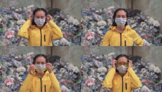 在塑料回收站工作的女人戴上防护口罩和眼镜特写镜头高清在线视频素材下载