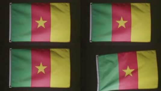 喀麦隆国旗在黑色背景下落下高清在线视频素材下载