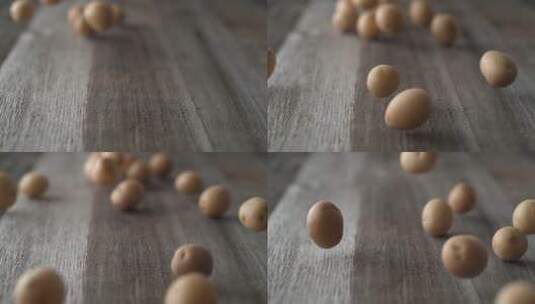 土豆在木桌上滚动高清在线视频素材下载