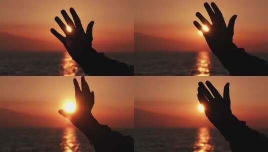 手的剪影在日落太阳高清在线视频素材下载