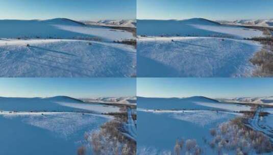 航拍冬季雪野中孤零零小屋高清在线视频素材下载