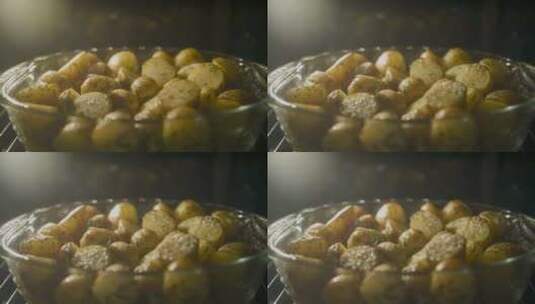 在烤箱中快速烘烤金土豆高清在线视频素材下载