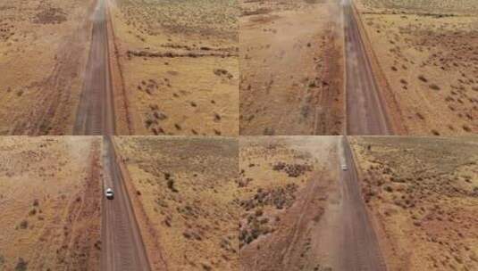 沙尘暴导致开阔沙漠公路上的旅行车，空中高清在线视频素材下载