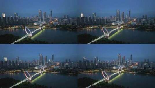 南京河西南京眼步行桥奥体双子塔的夜景风光高清在线视频素材下载