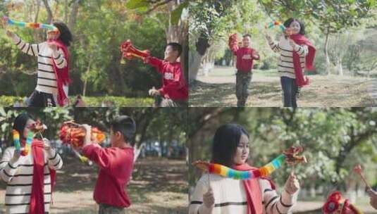 龙年春节实拍素材小孩在公园玩耍舞龙高清在线视频素材下载