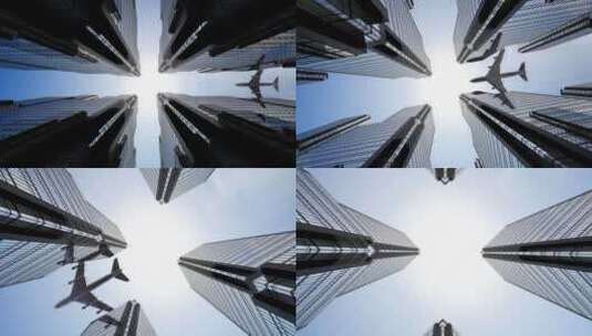 飞机飞过城市高楼大厦的特写镜头高清在线视频素材下载