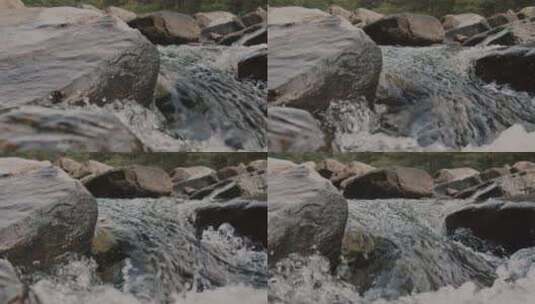 岩石中湍急的水流特写高清在线视频素材下载