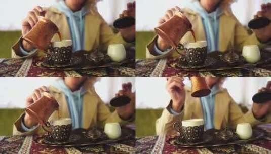 女人把土耳其咖啡从塞兹韦倒入杯子特写镜头高清在线视频素材下载
