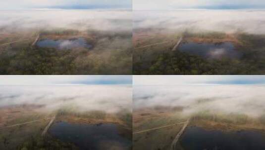 航拍被大雾笼罩的山脉森林高清在线视频素材下载