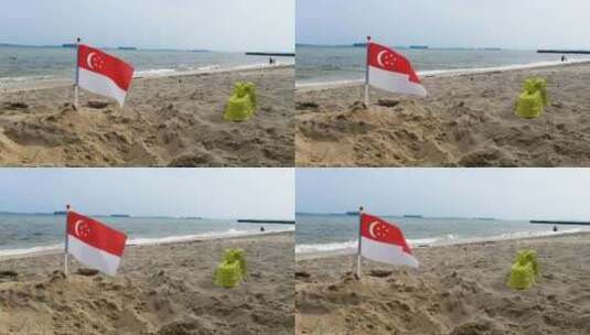 新加坡国旗-在沙滩上迎风飘扬高清在线视频素材下载