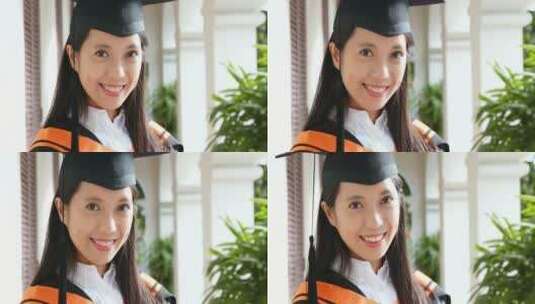 女生穿着毕业服对着镜头微笑高清在线视频素材下载