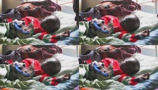 非洲婴儿躺在医院的床上高清在线视频素材下载