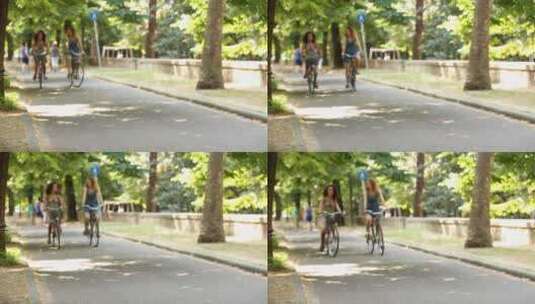 女孩在公园骑自行车高清在线视频素材下载