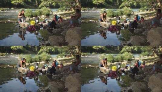 非洲妇女在河里洗衣服高清在线视频素材下载