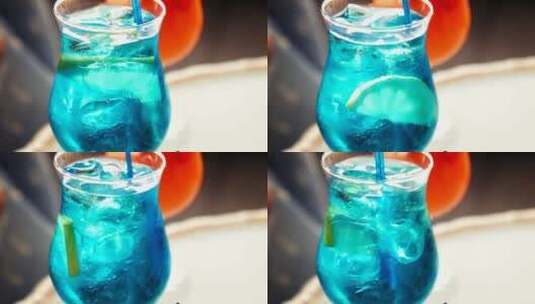 热带蓝色饮料配一片水果高清在线视频素材下载