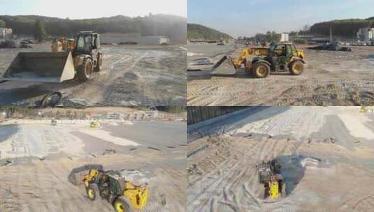 挖掘机在足球场建设中挖沙高清在线视频素材下载