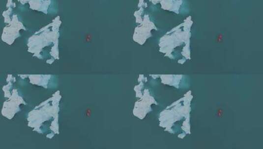 探索冰岛冰川蓝色泻湖的红色旅游船。船正经过。高清在线视频素材下载