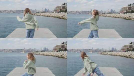 伊斯坦布尔海滨跳舞的美丽少女高清在线视频素材下载