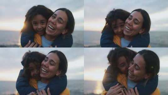 女孩在海滩上拥抱她的母亲高清在线视频素材下载