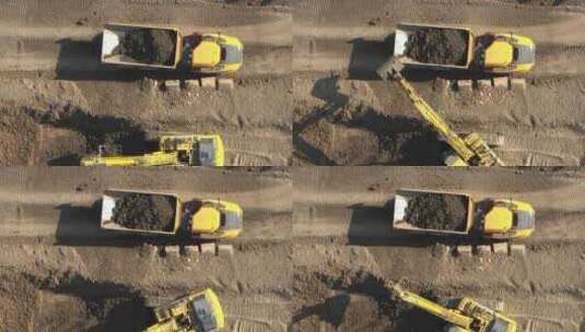 挖掘机装载泥土的自卸卡车高清在线视频素材下载