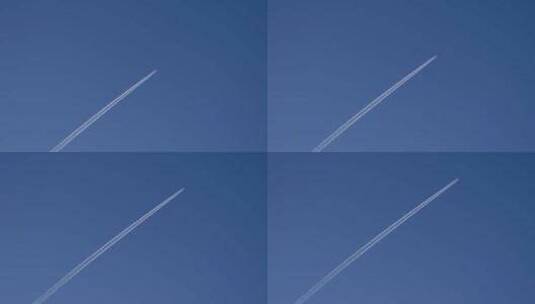 飞机飞过蓝天，留下唯美尾流高清在线视频素材下载