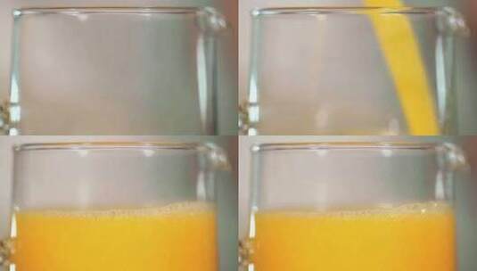 将橙汁倒入透明的玻璃杯高清在线视频素材下载