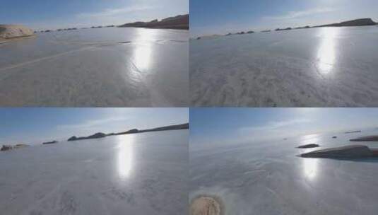 fpv穿越机航拍乌素特水上雅丹冰封湖面高清在线视频素材下载