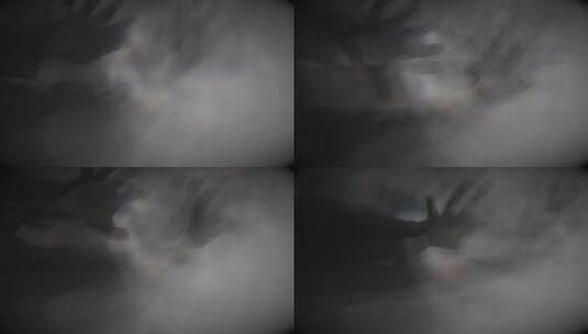 雾中模糊的手部特写高清在线视频素材下载