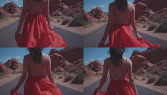 女人穿着红色太阳裙在公路上行走高清在线视频素材下载