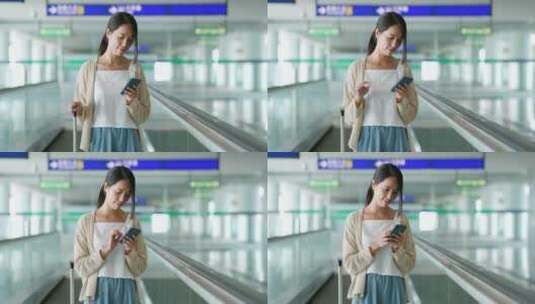 女人在机场扶梯上使用手机高清在线视频素材下载