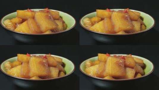 浙江菜红烧冬瓜菜品4k视频黑色背景高清在线视频素材下载