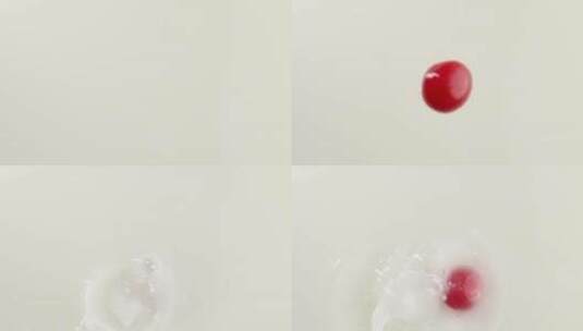 慢镜头拍摄新鲜小番茄落入牛奶创意视频高清在线视频素材下载