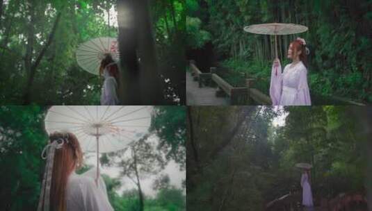 古风女子下雨中撑伞树林(包含未调色原视频)高清在线视频素材下载