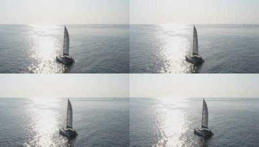 海上波光粼粼的帆船航拍高清在线视频素材下载