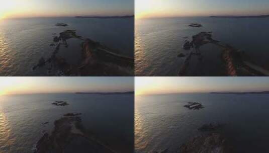 航拍威海刘公岛东泓海面的晨光高清在线视频素材下载