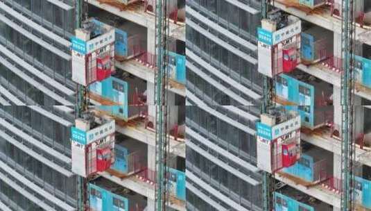 中国建筑工地施工进展航拍施工电梯安装高清在线视频素材下载