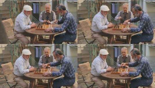 退休老人围着桌子下国际象棋  高清在线视频素材下载
